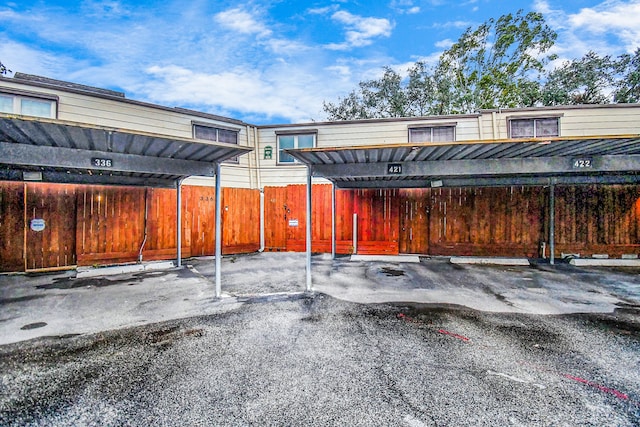 view of vehicle parking featuring a carport