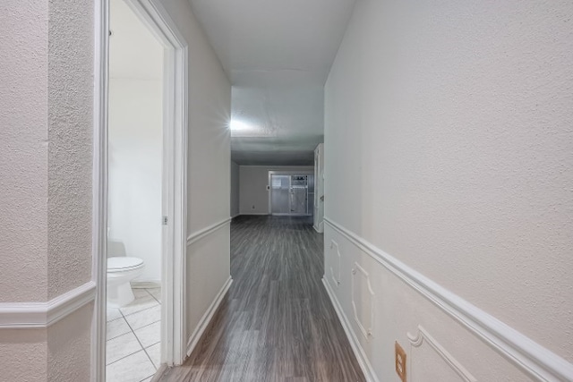 corridor with dark wood-type flooring