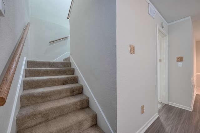 stairway featuring hardwood / wood-style flooring