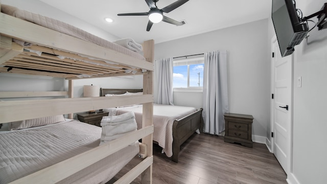 bedroom with ceiling fan and hardwood / wood-style floors