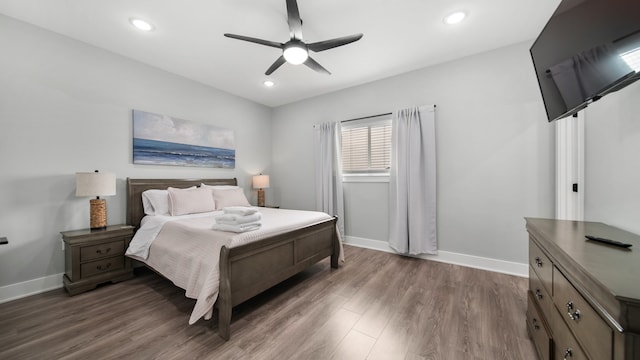 bedroom featuring dark hardwood / wood-style floors and ceiling fan