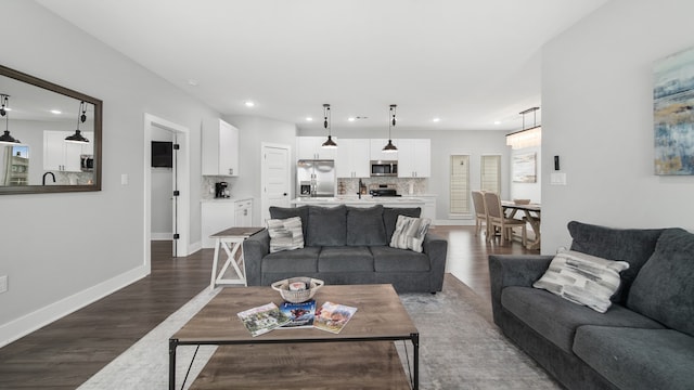 living room with dark wood-type flooring