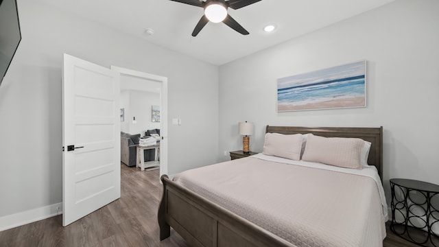 bedroom featuring hardwood / wood-style floors and ceiling fan