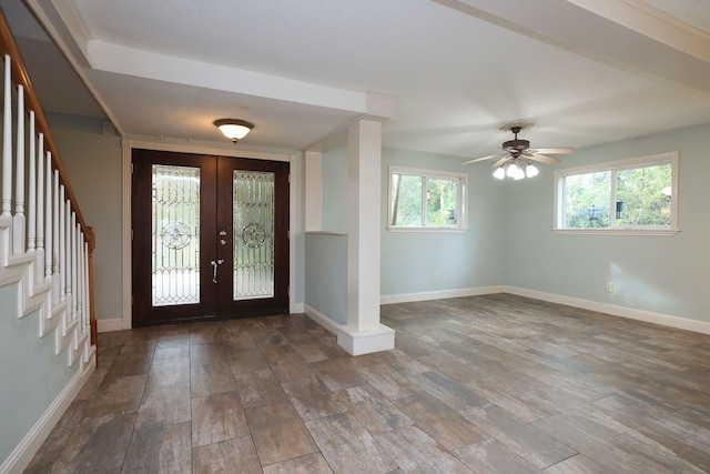 entryway with french doors, plenty of natural light, wood-type flooring, and ceiling fan