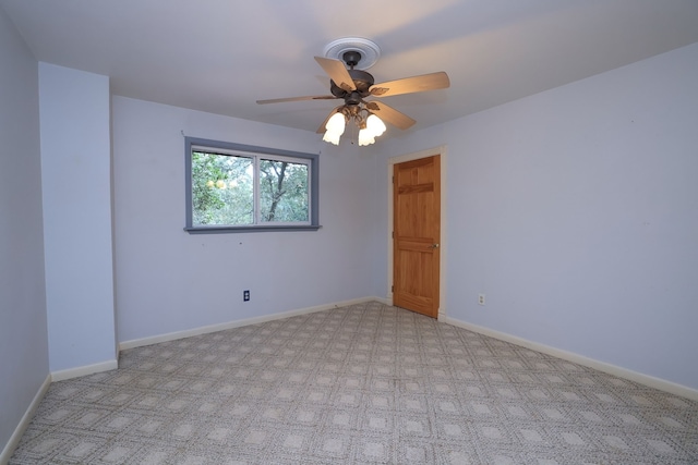 unfurnished room featuring light colored carpet and ceiling fan