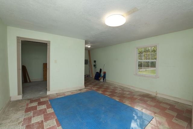 basement featuring a textured ceiling