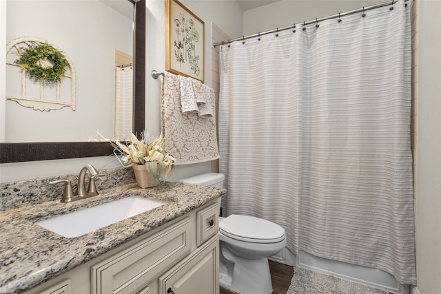 full bathroom featuring vanity, shower / bath combination with curtain, wood-type flooring, and toilet