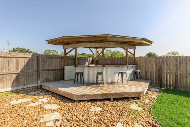 deck featuring a gazebo and an outdoor bar