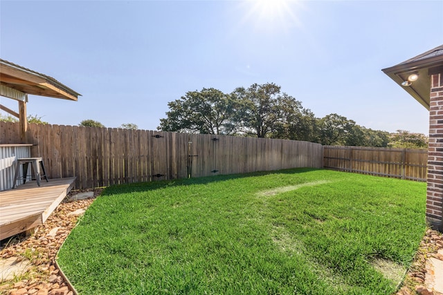 view of yard featuring a wooden deck