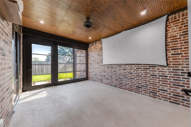 unfurnished sunroom with wooden ceiling