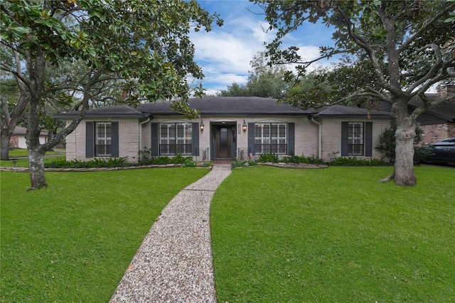 ranch-style house with a front lawn