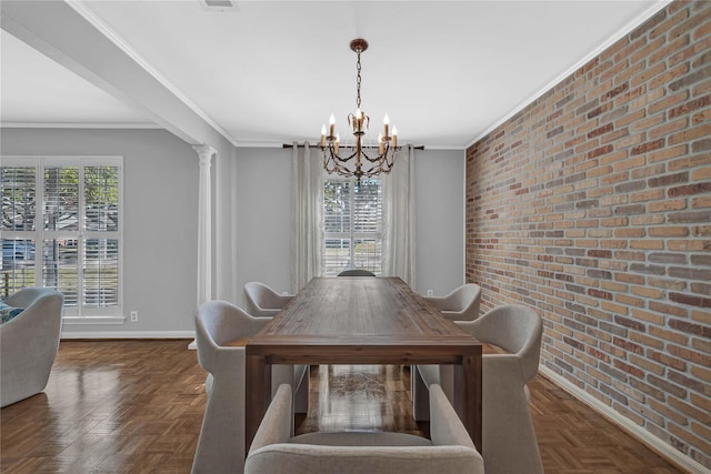 dining space with plenty of natural light, dark parquet floors, ornate columns, and brick wall