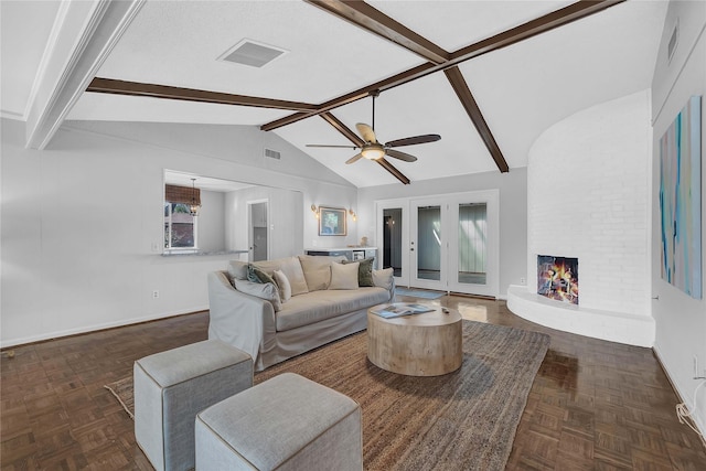 living room featuring ceiling fan, dark parquet floors, lofted ceiling with beams, and a brick fireplace