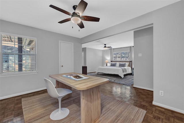 bedroom with dark parquet flooring and ceiling fan