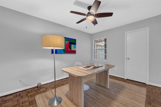 office with parquet flooring and ceiling fan