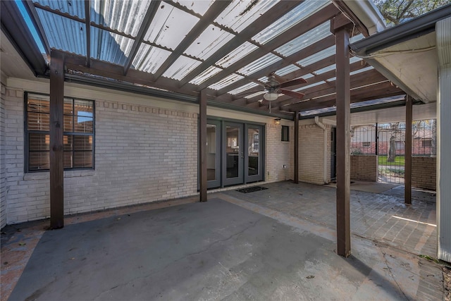 view of patio / terrace with a pergola, french doors, and ceiling fan