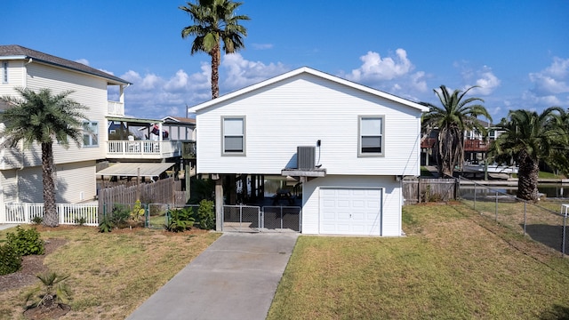 view of front facade featuring a carport, a front lawn, and a garage