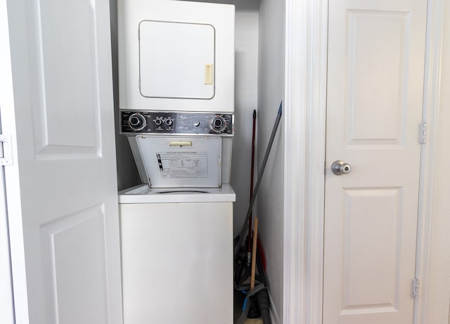 washroom with stacked washer and dryer