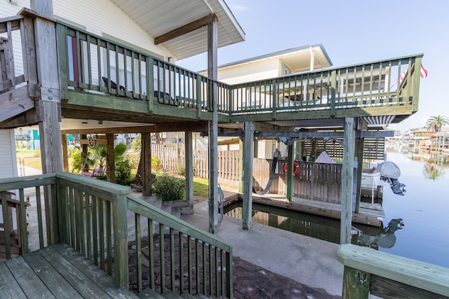 exterior space with a deck with water view