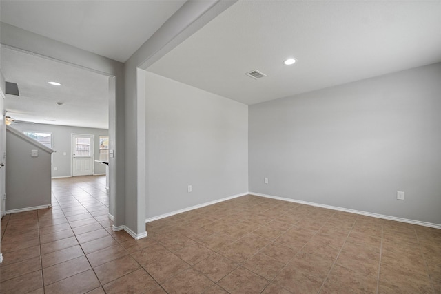 unfurnished room featuring light tile patterned floors, baseboards, visible vents, and recessed lighting