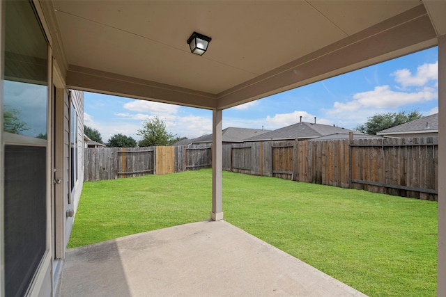 view of yard with a patio area and a fenced backyard