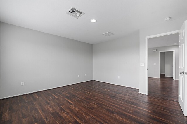 empty room with dark wood-type flooring