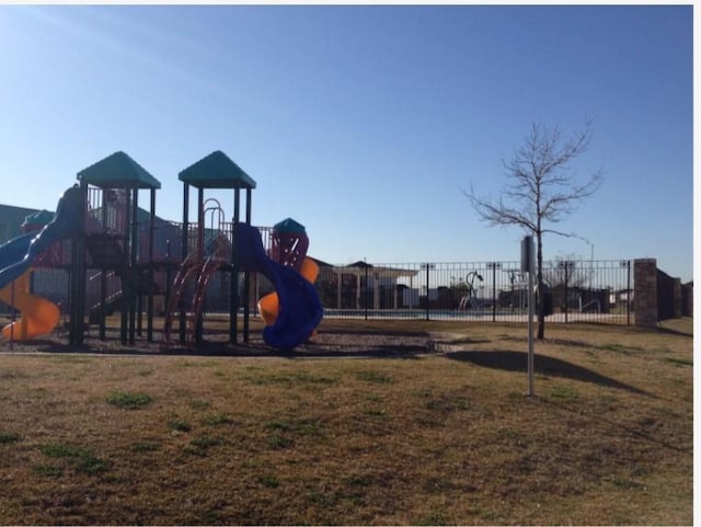 view of jungle gym with a yard