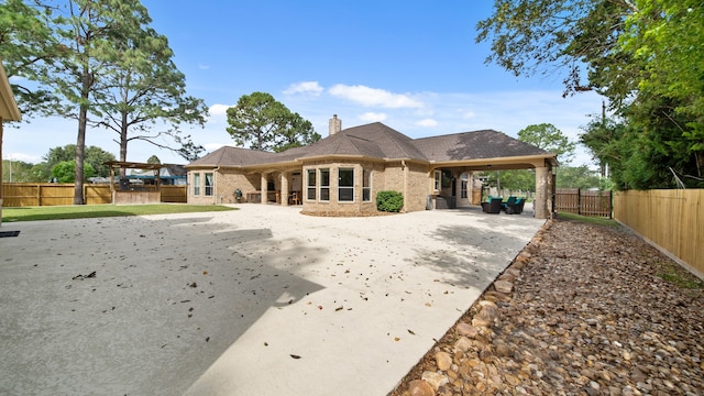 back of property featuring a carport