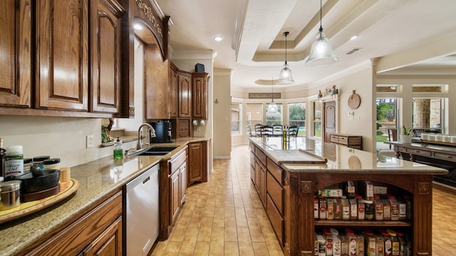 kitchen featuring dishwasher, a center island, crown molding, sink, and hanging light fixtures