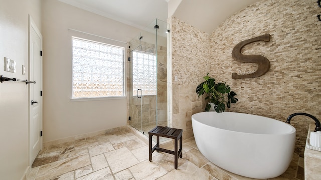 bathroom featuring separate shower and tub and ornamental molding