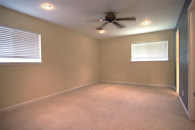 carpeted empty room with ceiling fan