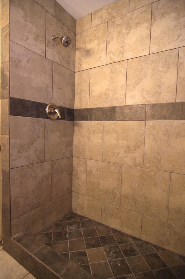 bathroom with a tile shower