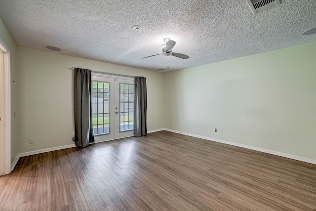 unfurnished room featuring french doors, hardwood / wood-style flooring, a textured ceiling, and ceiling fan