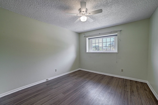 unfurnished room with a textured ceiling, dark hardwood / wood-style floors, and ceiling fan