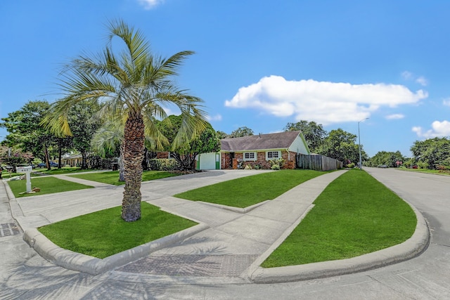 view of front of house featuring a front lawn and a garage