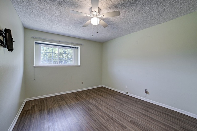 spare room featuring ceiling fan, a textured ceiling, and dark hardwood / wood-style floors