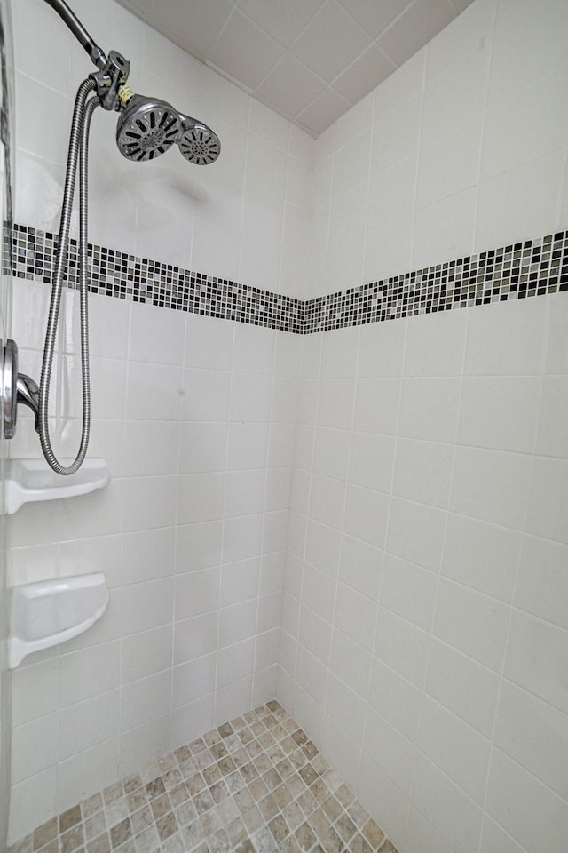 bathroom with a tile shower