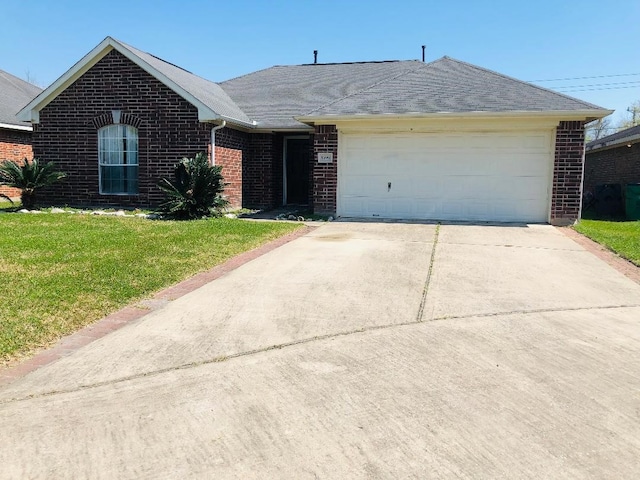 single story home featuring a front yard and a garage