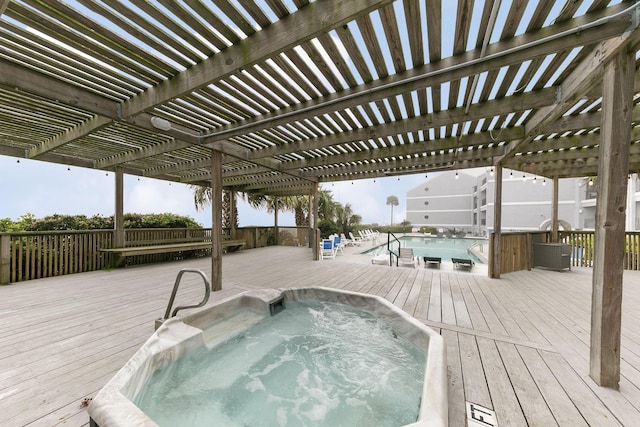 7600 Seawall Blvd Unit 115, Galveston, TX 77551 - deck featuring a pergola