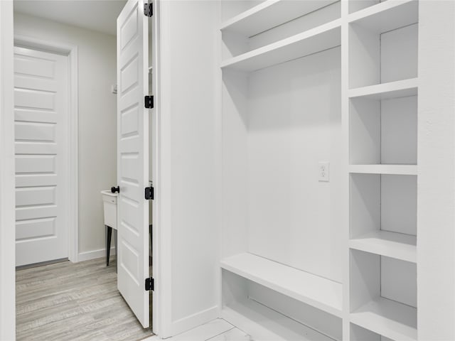 mudroom with light hardwood / wood-style flooring