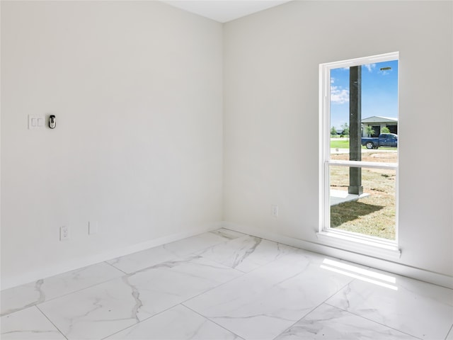 empty room featuring plenty of natural light