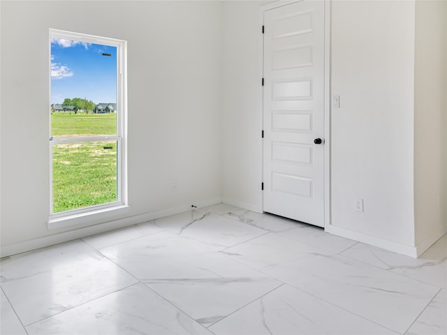 spare room featuring plenty of natural light