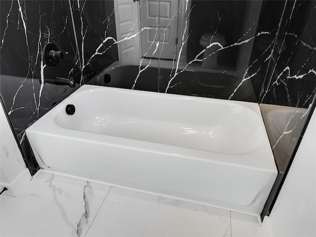 interior details featuring a bathtub