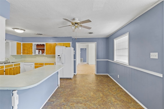 kitchen with a textured ceiling, ceiling fan, white appliances, and sink