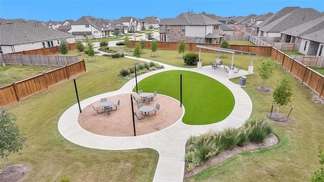5310 Quartz Ranch Dr, Richmond, TX 77469 - view of property's community with a yard, a residential view, and fence