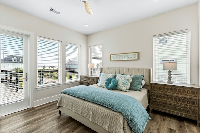 bedroom featuring access to outside, hardwood / wood-style floors, and ceiling fan