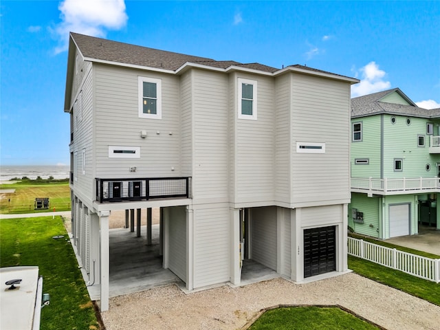 rear view of house with a garage