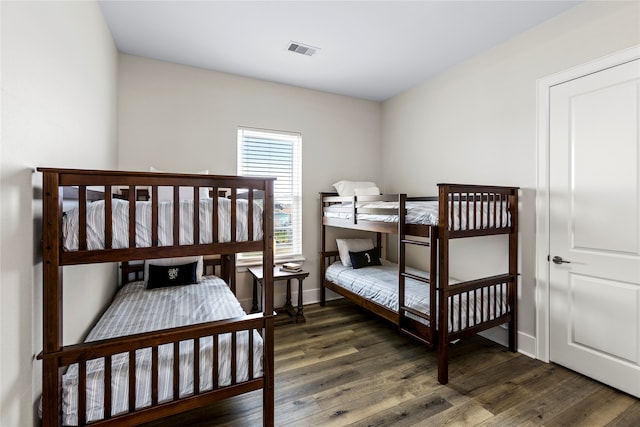 bedroom featuring dark wood-type flooring