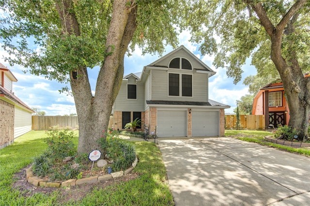 view of front of home with a front lawn and a garage