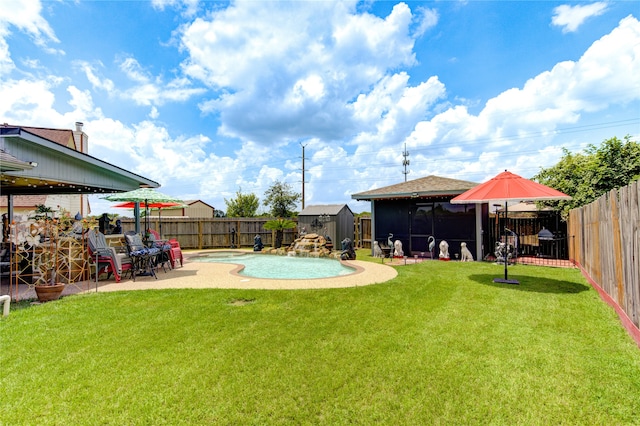 view of yard featuring a patio and a fenced in pool